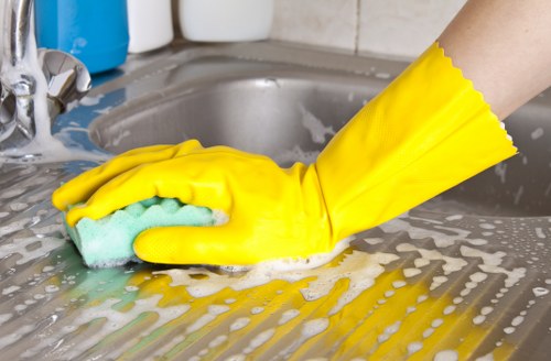 Blotting a fresh pet accident on upholstery with paper towels